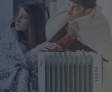 Couple Cuddling Up Next to Electric Heater