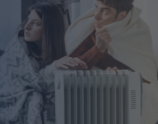 Couple Cuddling Up Next to Electric Heater