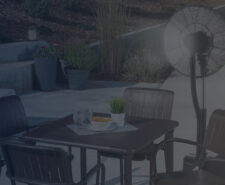 Fan Blowing Mist on Outdoor Dining Table