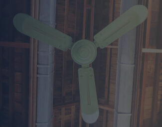 Green Vintage Fan Hanging from Ceiling