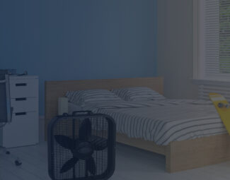 Lasko Box Fan Cooling a Bedroom