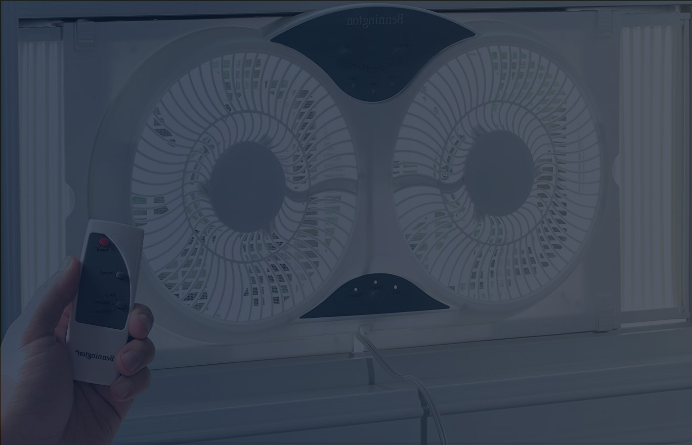 Man Operating a Window Fan