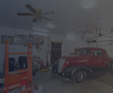 Packed Garage with Two Ceiling Fans Installed