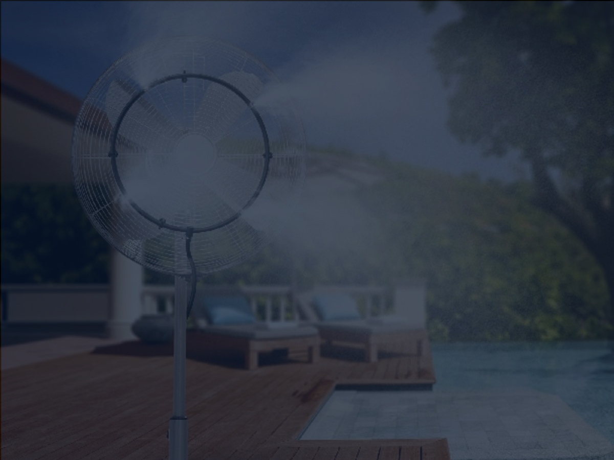 Pedestal Misting Fan Releasing Mist on Pool Deck