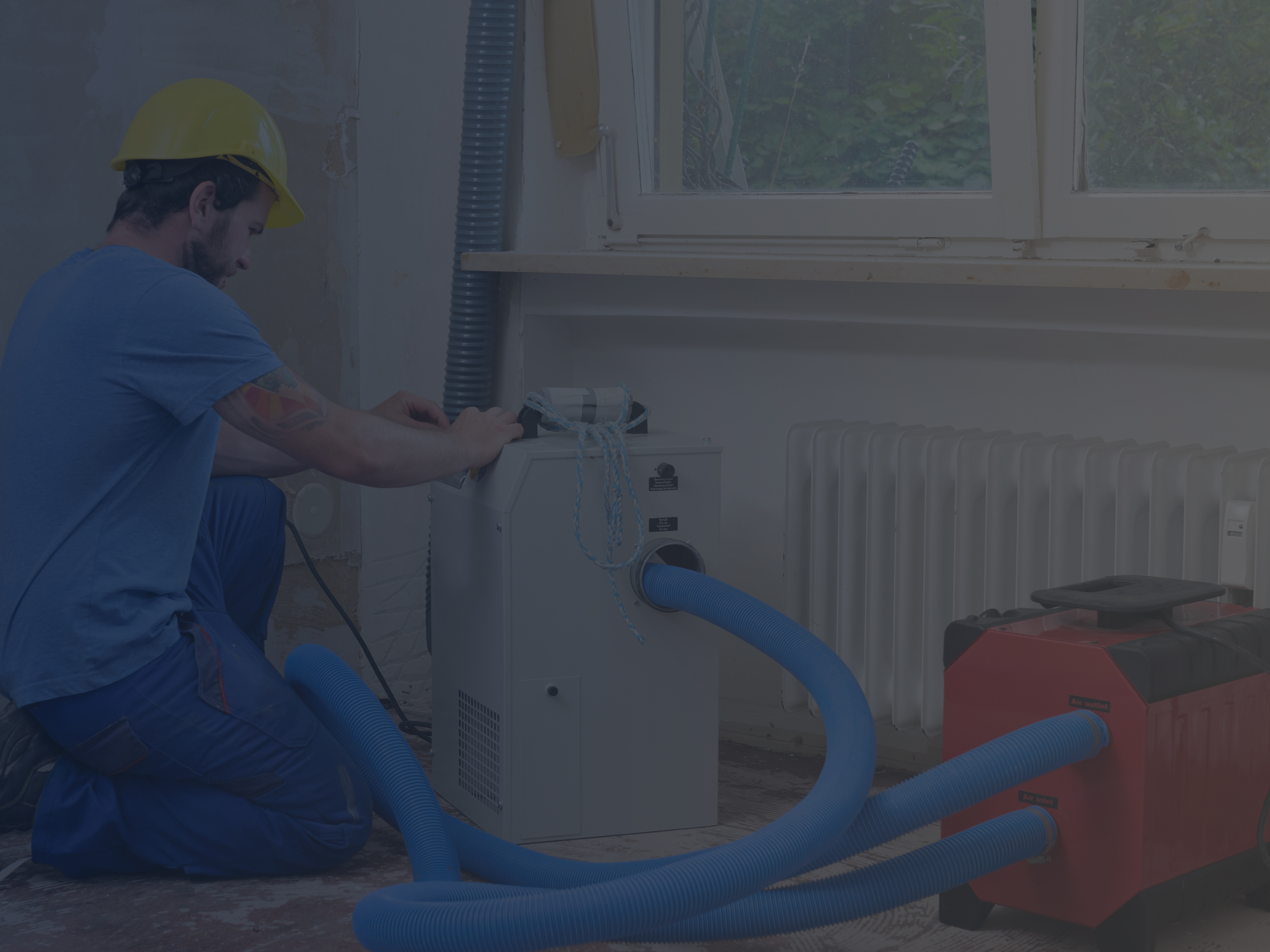 Man Installing Dehumidifier in Home