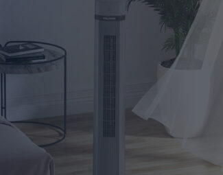 Tower Fan Placed on the Floor Between Bed and Window