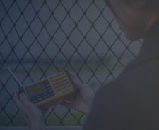 Woman Listening to Weather Alert Radio