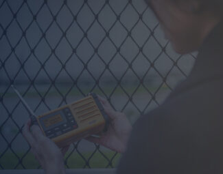 Woman Listening to Weather Alert Radio