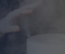 Woman Keeps Hand over the Mist Released by a Humidifier