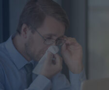 Office Worker Dealing with Seasonal Allergy in the Office