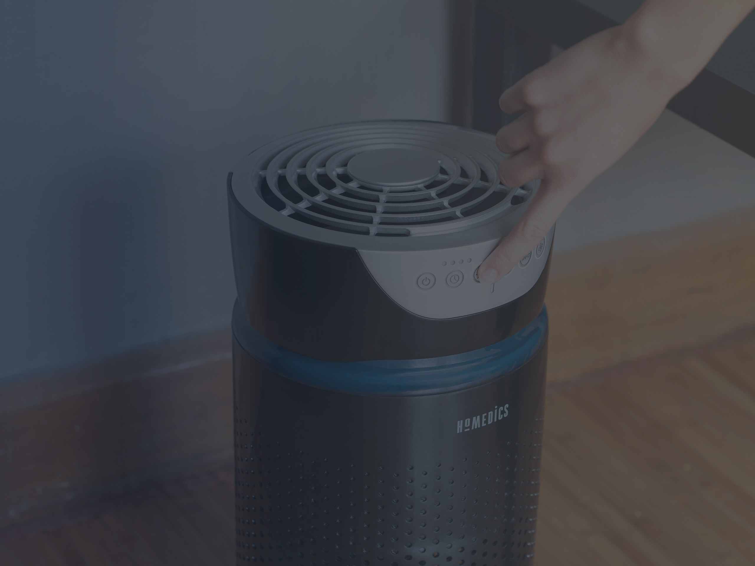 Woman Changing Setting on the Air Ionizer Purifier