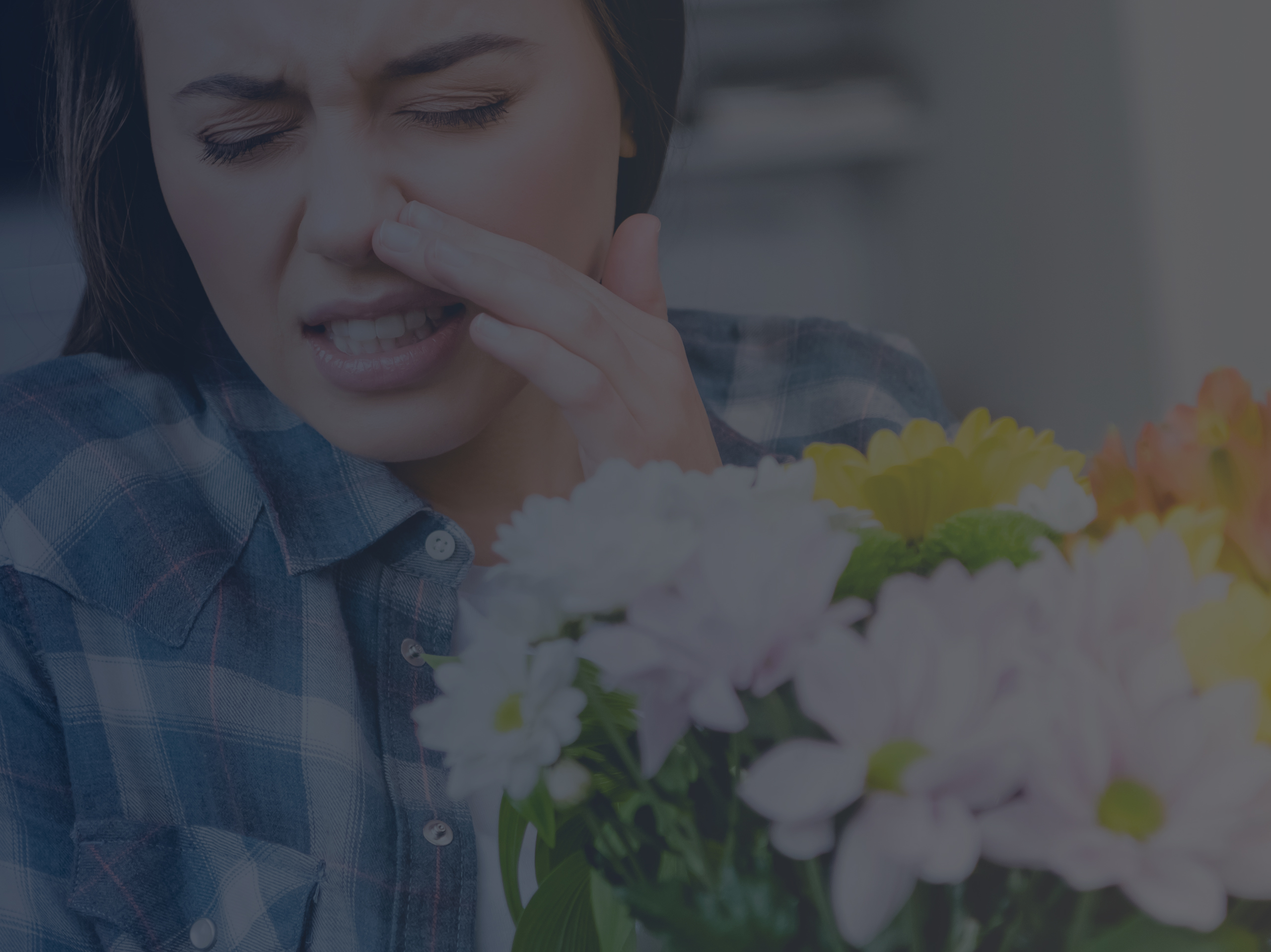 Young Woman Holding a Bouquet of Flowers and Sneezing