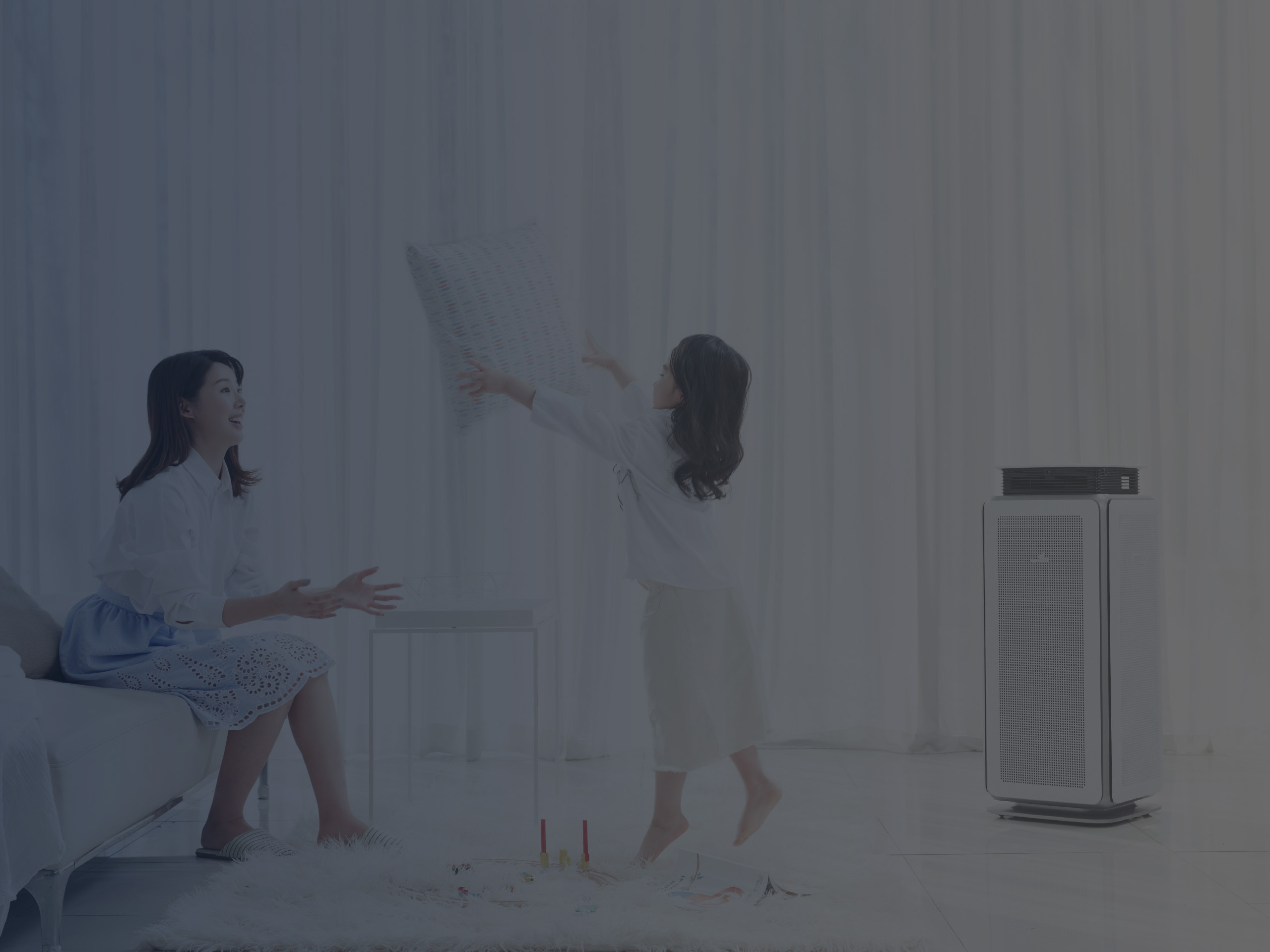 Mother and Daughter Playing in Living Room Where the Air Purifier Functions